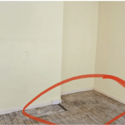 Bedroom 1 (Before) -  Room requires floorboards and flooring replacement, new radiator and full decoration