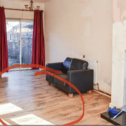 Lounge (Before) - Flooring and chimney breast before rip-out