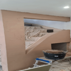 Staircase (After): Completed plaster work over the newly constructed staircase wall